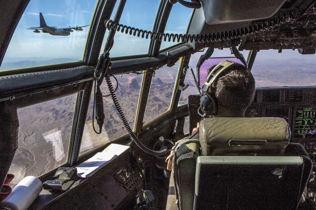 Marine Corps Maj. Andrew D. Myers flies a KC-130J Super Hercules during an aerial delivery during a training event near Marine Corps Air Station Yuma, Ariz., March 31, 2017. Myers is a KC-130J instructor pilot, Marine Aviation Weapons and Tactics Squadron One. Marine Corps photo by Lance Corporal Clare J. Shaffer