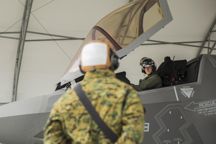 U.S. Marine Corps Maj. Adam Perlin, aircraft maintenance officer for Marine Fighter Attack Squadron (VMFA) 121, conducts an aircraft check during hot-reload training at Marine Corps Air Station Iwakuni, Japan, April 6, 2017. This signified the first time the squadron loaded ordnance onto a running F-35B Lightning II aircraft at the air station in order to prepare for real-world scenarios. (U.S. Marine Corps photo by Lance Cpl. Joseph Abrego)