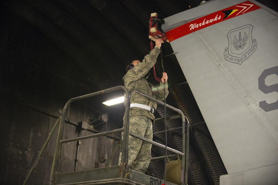 U.S. Air Force Tech. Sgt. Matthew Hoover, Combat Shield flight chief from the 16th Electronic Warfare Squadron, Eglin Air Force Base, Fla., attaches a testing device onto an F-16 Fighting Falcon at Spangdahlem Air Base, Germany, March 23, 2017. A Combat Shield team visited Spangdahlem March
20-24 to evaluate the reliability of several F-16s’ radar threat warning systems and countermeasures. (U.S. Air Force photo by Senior Airman Dawn M. Weber)