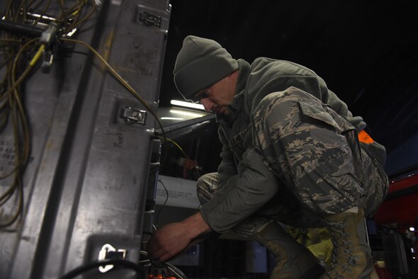 U.S. Air Force Tech. Sgt. Jesse Pickrell, Combat Shield crew lead, 16th Electronic Warfare Squadron, Eglin Air Force
Base, Fla., prepares a USM-642 Raven signal generator on the flighline at Spangdalem Air Base, Germany, March 23, 2017, during a Combat Shield inspection. The Combat Shield crew used the USM-642 to simulate real-world radar emissions and test the sensitivity of the threat detection systems of an F-16 assigned to Spangdahlem. (U.S. Air Force photo by Senior Airman Dawn M. Weber)