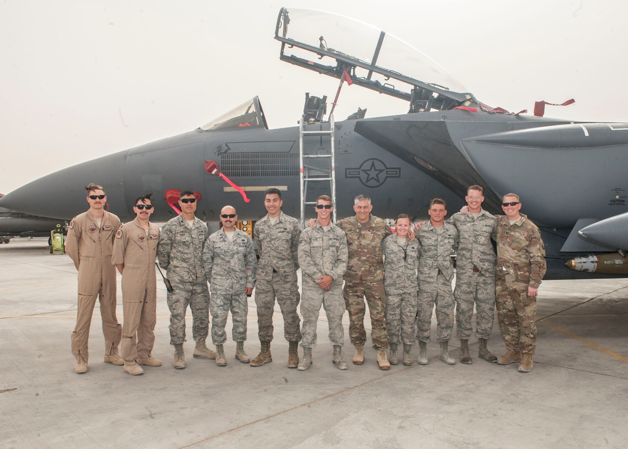 U.S. Army Lt. Gen. Stephen Townsend, Combined Joint Task Force – Operation Inherent Resolve commanding general, poses for a photo with Airmen deployed to the 332nd Air Expeditionary Wing April 5, 2017, in Southwest Asia. The general visited Airmen and Soldiers thanking them for their contribution to the mission. (U.S. Air Force photo by Tech Sgt. Eboni Reams)