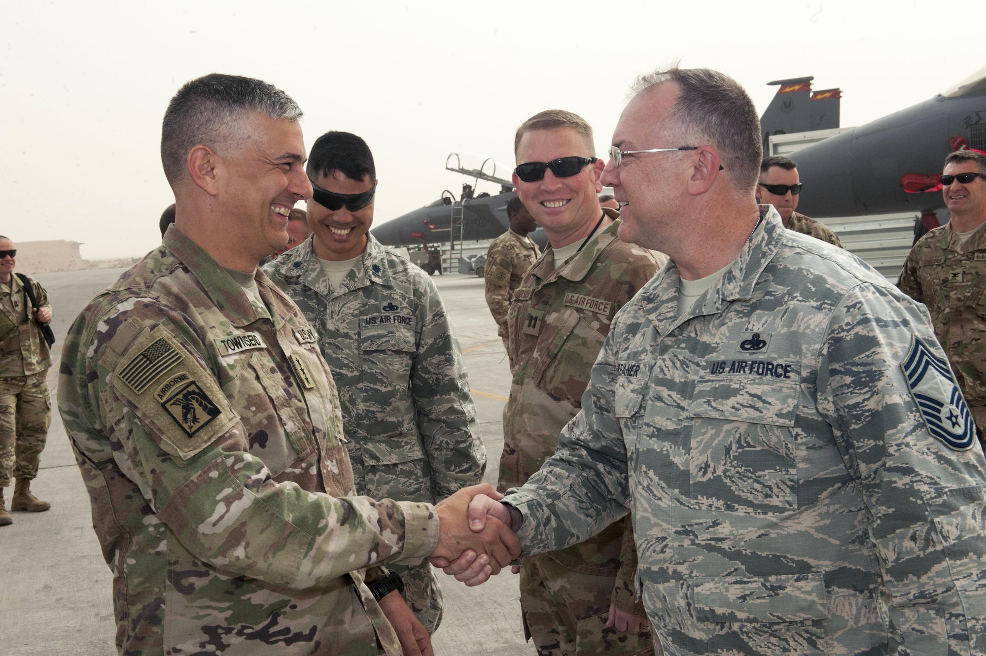 U.S. Army Lt. Gen. Stephen Townsend, Combined Joint Task Force – Operation Inherent Resolve commanding general, shakes hands with U.S. Air Force Chief Master Sgt. Raymond Phreaner, 332nd Expeditionary Maintenance Squadron, chief enlisted manager April 5, 2017, in Southwest Asia. The general visited Airmen and Soldiers thanking them for their contribution to the mission. (U.S. Air Force photo by Tech Sgt. Eboni Reams)