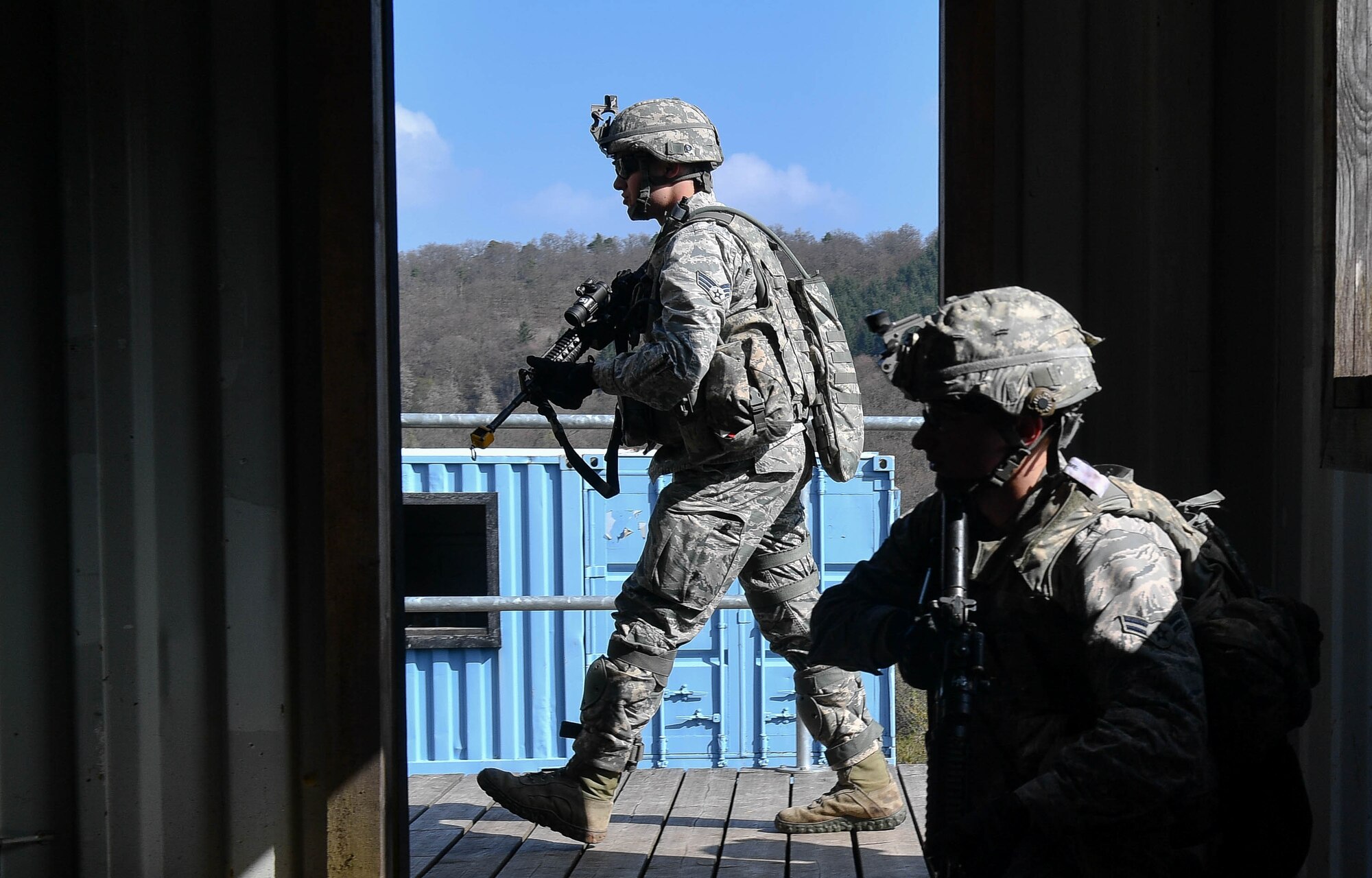 Airman 1st Class Paul Deitz, 569th U.S. Forces Police Squadron patrolman, crouches inside a building during the urban operations portion of the 435th Security Forces Squadron’s Ground Combat Readiness Training Center’s Security Operations Course on U.S. Army Garrison Baumholder, Germany, April 4, 2017. The purpose of the two-week course was to train security forces Airmen who were about to deploy. Airmen assigned to the 86th SFS, 422nd SFS, 100th SFS, and 569th USFPS participated in the course. (U.S. Air Force photo by Senior Airman Tryphena Mayhugh)