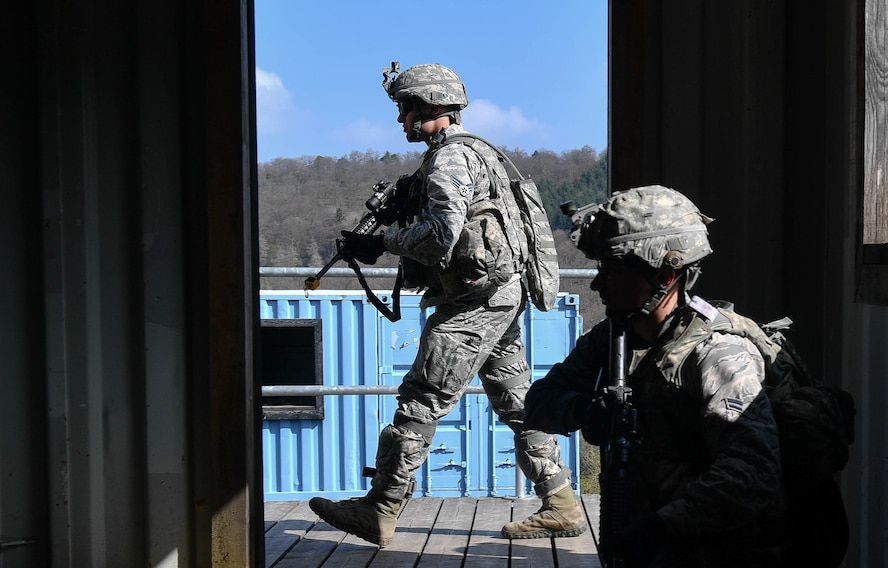 Airman 1st Class Paul Deitz, 569th U.S. Forces Police Squadron patrolman, crouches inside a building during the urban operations portion of the 435th Security Forces Squadron’s Ground Combat Readiness Training Center’s Security Operations Course on U.S. Army Garrison Baumholder, Germany, April 4, 2017. The purpose of the two-week course was to train security forces Airmen who were about to deploy. Airmen assigned to the 86th SFS, 422nd SFS, 100th SFS, and 569th USFPS participated in the course. (U.S. Air Force photo by Senior Airman Tryphena Mayhugh)