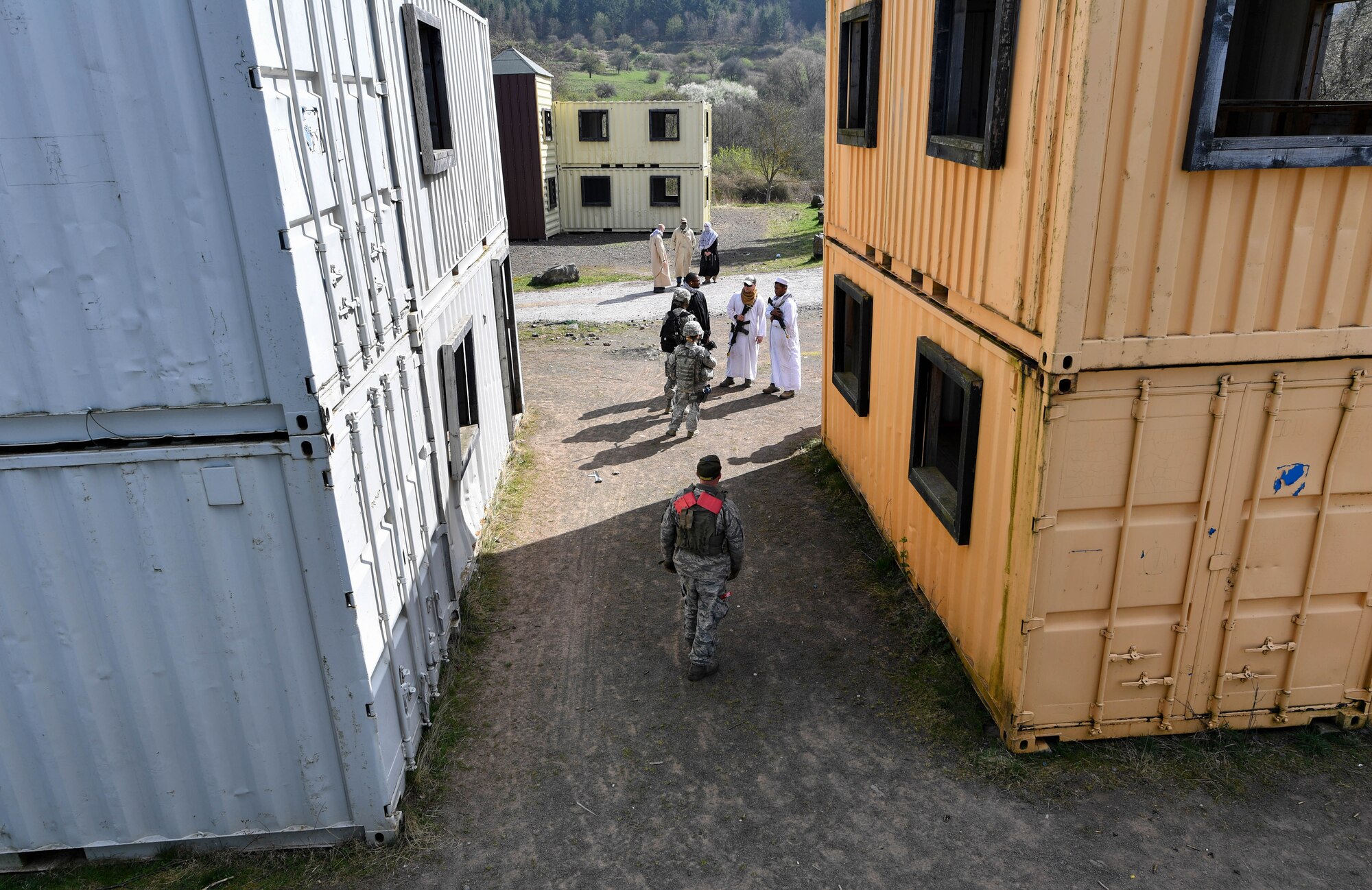 Students of the 435th Security Forces Squadron’s Ground Combat Readiness Training Center’s Security Operations Course speak to simulated foreign village leaders during the urban operations portion of the course on U.S. Army Garrison Baumholder, Germany, April 4, 2017. The student’s mission was to make contact with the village leader and gain intelligence from him. Airmen assigned to the 86th SFS, 422nd SFS, 100th SFS, and 569th U.S. Forces Police Squadron participated in the course. (U.S. Air Force photo by Senior Airman Tryphena Mayhugh)