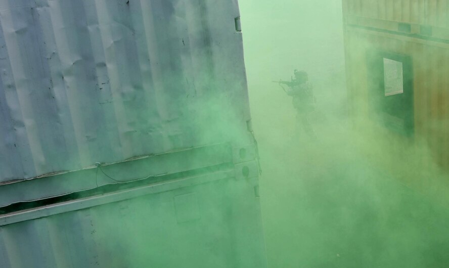 Staff Sgt. Katelyn McHale, 569th U.S. Forces Police Squadron desk sergeant, tactically moves through a simulated village filled with smoke during the urban operations portion of the 435th Security Forces Squadron’s Ground Combat Readiness Training Center’s Security Operations Course on U.S. Army Garrison Baumholder, Germany, April 4, 2017. The two-week course began March 24 and provides pre-deployment training to security forces Airmen who will be going downrange. Airmen assigned to the 86th SFS, 422nd SFS, 100th SFS, and 569th USFPS participated in the course. (U.S. Air Force photo by Senior Airman Tryphena Mayhugh)