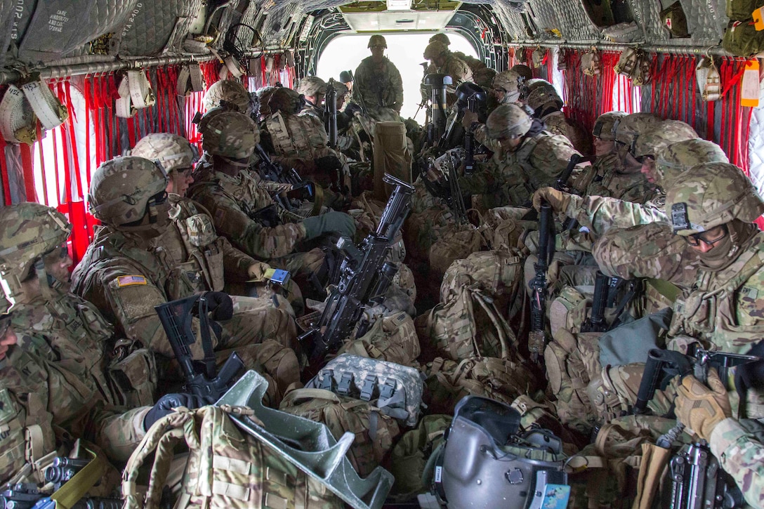 Soldiers sit in a CH-47 Chinook helicopter during air assault training  at Grafenwoehr Training Area, Germany, April 6, 2017. Army photo by Spc. Thomas Scaggs