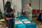 Air Force Master Sgt. Maggie Ladd (right) speaks to fellow associates during the Sexual Assault Awareness and Prevention Month information fair April 5 at Defense Supply Center Columbus. The fair promoted sexual assault prevention resources and announced activities taking place throughout the month in support of SAAPM.