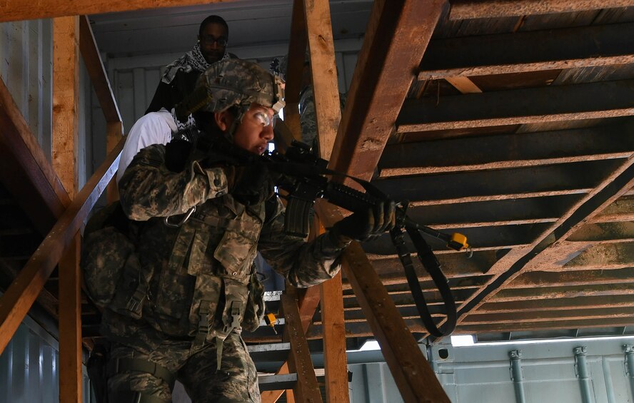 Staff Sgt. Christian Gomez, 569th U.S. Forces Police Squadron Bravo Flight chief, walks down stairs during the urban operations portion of the 435th Security Forces Squadron’s Ground Combat Readiness Training Center’s Security Operations Course on U.S. Army Garrison Baumholder, Germany, April 4, 2017. During the urban ops portion of the course, the cadres used blank rounds and flash bangs to simulate an attack upon the students. Airmen assigned to the 86th SFS, 422nd SFS, 100th SFS, and 569th USFPS participated in the course. (U.S. Air Force photo by Senior Airman Tryphena Mayhugh)