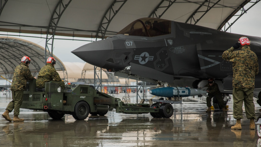 Marines with Marine Fighter Attack Squadron (VMFA) 121 load ordnance on an F-35B Lightning II aircraft during hot-reload training at Marine Corps Air Station Iwakuni, Japan, April 6, 2017. This signified the first time the squadron loaded ordnance onto a running F-35B Lightning II aircraft at the air station in order to prepare for real-world scenarios. 