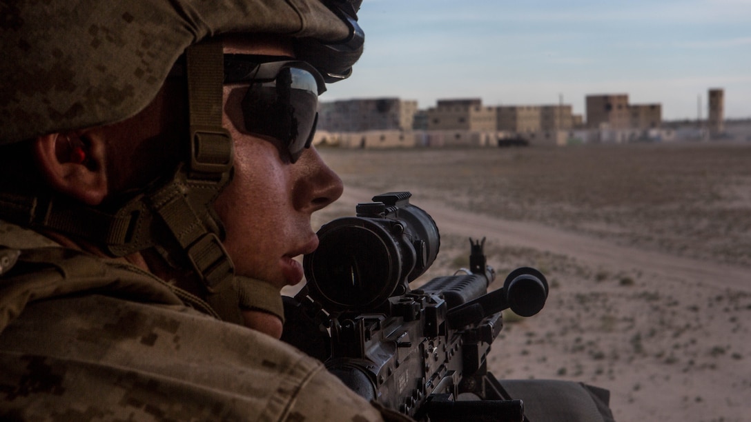 Pfc. Tristan Spatz, machine gunner with Weapons Company, 2nd Battalion, 6th Marine Regiment, fires an M249 Infantry Light Machine Gun during an urban close air support exercise at Weapons and Tactics Instructor Course (WTI) 2-17 at Yodavilla, Ariz., April 6, 2017. The UCAS exercise was designed to focus on specific employment of tactical air and rotary wing offensive air support aviation assets in order to support the ground combat element scheme of maneuver. WTI is a seven-week training event hosted by MAWTS-1 cadre, which emphasizes operational integration of the six functions of Marine Corps aviation in support of a Marine Air Ground Task Force and provides standardized advanced tactical training and certification of unit instructor qualifications to support Marine Aviation Training and Readiness and assists in developing and employing aviation weapons and tactics. 