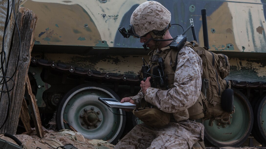 A Marine sends coordinates during an urban close air support (UCAS) exercise at Weapons and Tactics Instructor Course (WTI) 2-17 at Yodaville, Ariz., April 6, 2017. The UCAS exercise was designed to focus on specific employment of tactical air and rotary wing offensive air support aviation assets in order to support the ground combat element scheme of maneuver. WTI is a seven-week training event hosted by MAWTS-1 cadre, which emphasizes operational integration of the six functions of Marine Corps aviation in support of a Marine Air Ground Task Force and provides standardized advanced tactical training and certification of unit instructor qualifications to support Marine Aviation Training and Readiness and assists in developing and employing aviation weapons and tactics. 