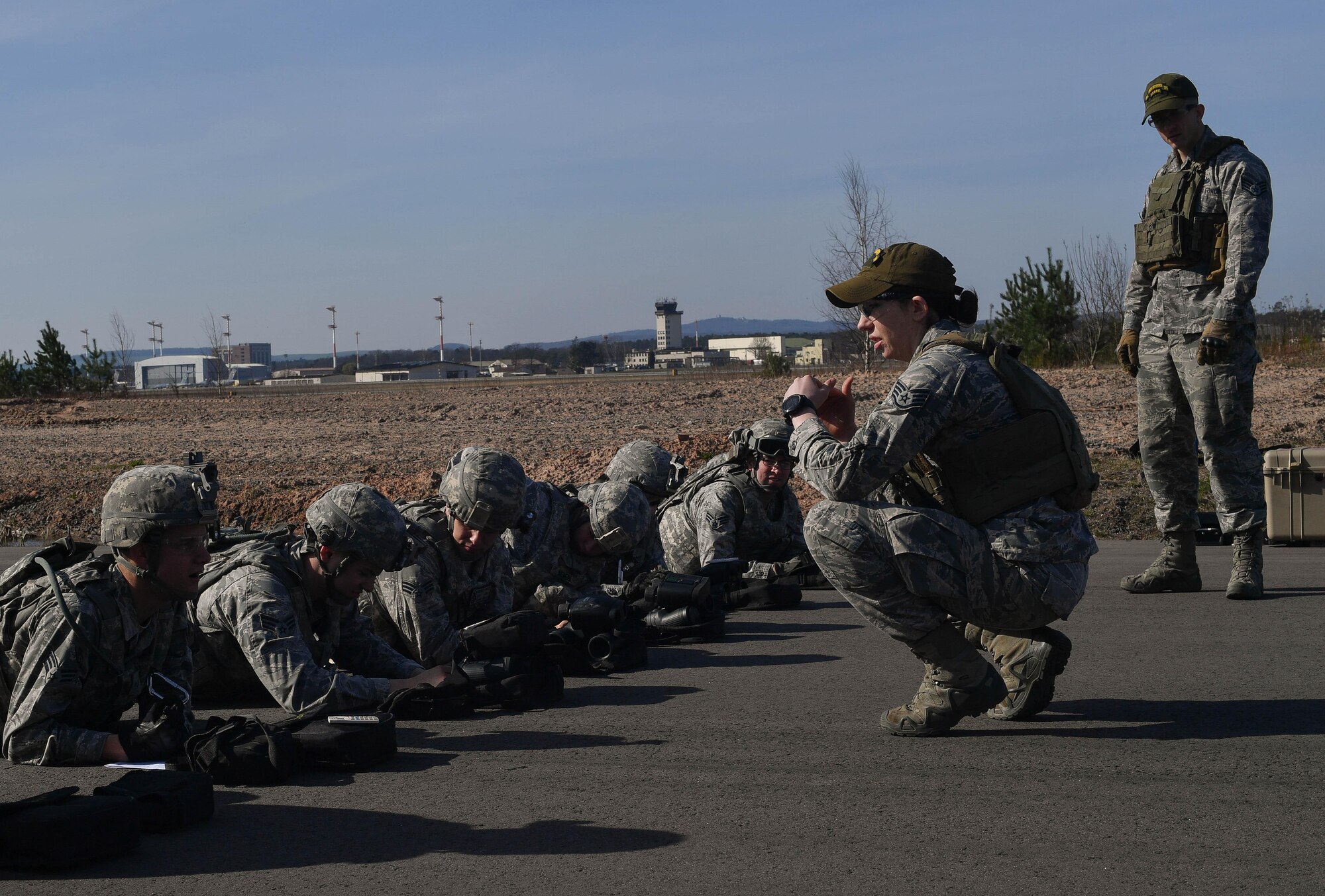 Staff Sgt. Kelsea Ashmore, 435th Security Forces Squadron’s Ground Combat Readiness Training Center instructor, expalins to students of the Security Operations Course how to estimate the distance of target during the range estimation portion of the course on Ramstein Air Base, Germany, March 25, 2017. The purpose of the two-week course is to prepare security forces Airmen who are deploying down range. Airmen assigned to the 86th SFS, 422nd SFS, 100th SFS, and 569th U.S. Forces Police Squadron participated in the course. (U.S. Air Force photo by Senior Airman Tryphena Mayhugh)