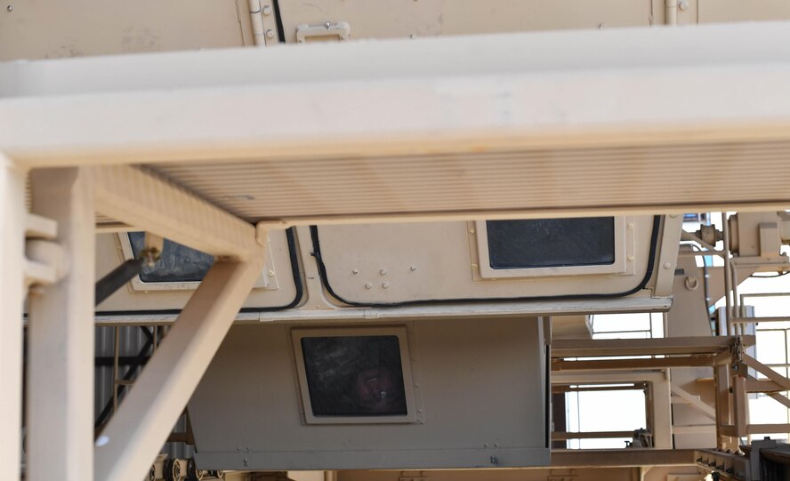 A student of the 435th Security Forces Squadron’s Ground Combat Readiness Training Center’s Security Operations Course hangs upside down inside a mock Humvee during the Humvee egress training portion of the course on Ramstein Air Base, Gemany, March 25, 2017. During the HET portion, students were rolled upside down multiple times inside a mock Humvee to prepare them for such a situation while deployed down range. Airmen assigned to the 86th SFS, 422nd SFS, 100th SFS, and 569th U.S. Forces Police Squadron participated in the course. (U.S. Air Force photo by Senior Airman Tryphena Mayhugh)