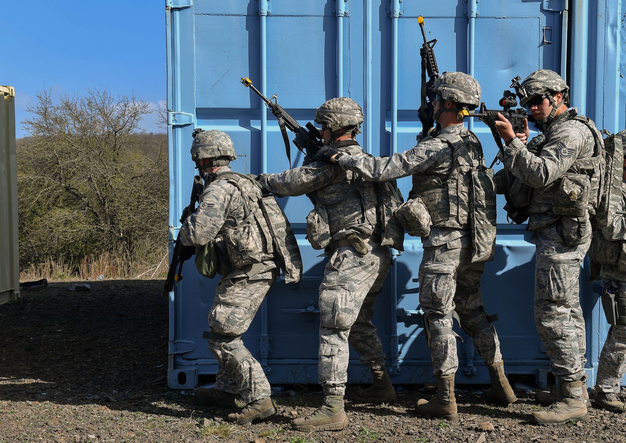 Students of the 435th Security Forces Squadron’s Ground Combat Readiness Training Center’s Security Operations Course prepare to tactically search a building during the urban operations portion of the course on U.S. Army Garrison Baumholder, Germany, April 4, 2017. The students had a mission to talk to a village leader and gain intelligence from him when they were attacked and had to neutralize the threat and make it back to their base. Airmen assigned to the 86th SFS, 422nd SFS, 100th SFS, and 569th U.S. Forces Police Squadron participated in the course. (U.S. Air Force photo by Senior Airman Tryphena Mayhugh)