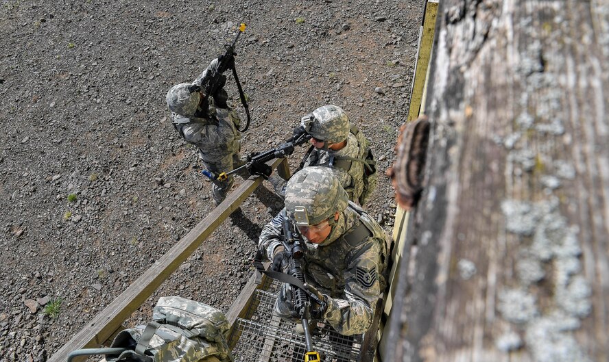Tech. Sgt. Christian Gomez, 569th U.S. Forces Police Squadron Bravo Flight chief, and other students of the 435th Security Forces Squadron’s Ground Combat Readiness Training Center’s Security Operations Course climb stairs to search the top floor of a building during the urban operations portion of the course on U.S. Army Garrison Baumholder, Germany, April 4, 2017. During the urban ops portion the course, the cadres used blank rounds and flash bangs to simulate an attack upon the students. Airmen assigned to the 86th SFS, 422nd SFS, 100th SFS, and 569th USFPS participated in the course. (U.S. Air Force photo by Senior Airman Tryphena Mayhugh)