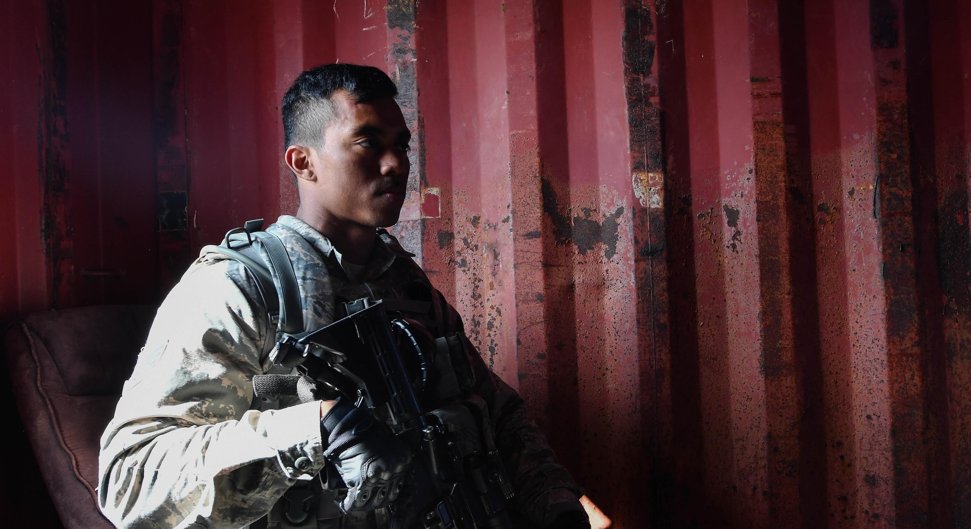 Senior Airman Shelumiel Jones, 569th U.S. Forces Police Squadron alarm monitor and entry controller, sits while his squadron commander talks to a simulated foreign village leader during the urban operations portion of the 435th Security Forces Squadron’s Ground Combat Readiness Training Center’s Security Operations Course on U.S. Army Garrison Baumholder, Germany, April 4, 2017. The student’s mission for the operation was to gain intelligence from the village leader. Airmen assigned to the 86th SFS, 422nd SFS, 100th SFS, and 569th USFPS participated in the course. (U.S. Air Force photo by Senior Airman Tryphena Mayhugh)