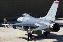 Airmen from the 52nd Aircraft Maintenance Squadron perform a “hot pit” on an F-16 Fighting Falcon at Spangdahlem Air Base, Germany, March 28, 2017. A “hot pit” is the refueling of an aircraft while its engine is still running. This type of refueling is more than 30% faster than shutting down the engine to refuel and doubles sortie generation time. (U.S. Air Force photo by Airman 1st Class Preston Cherry)