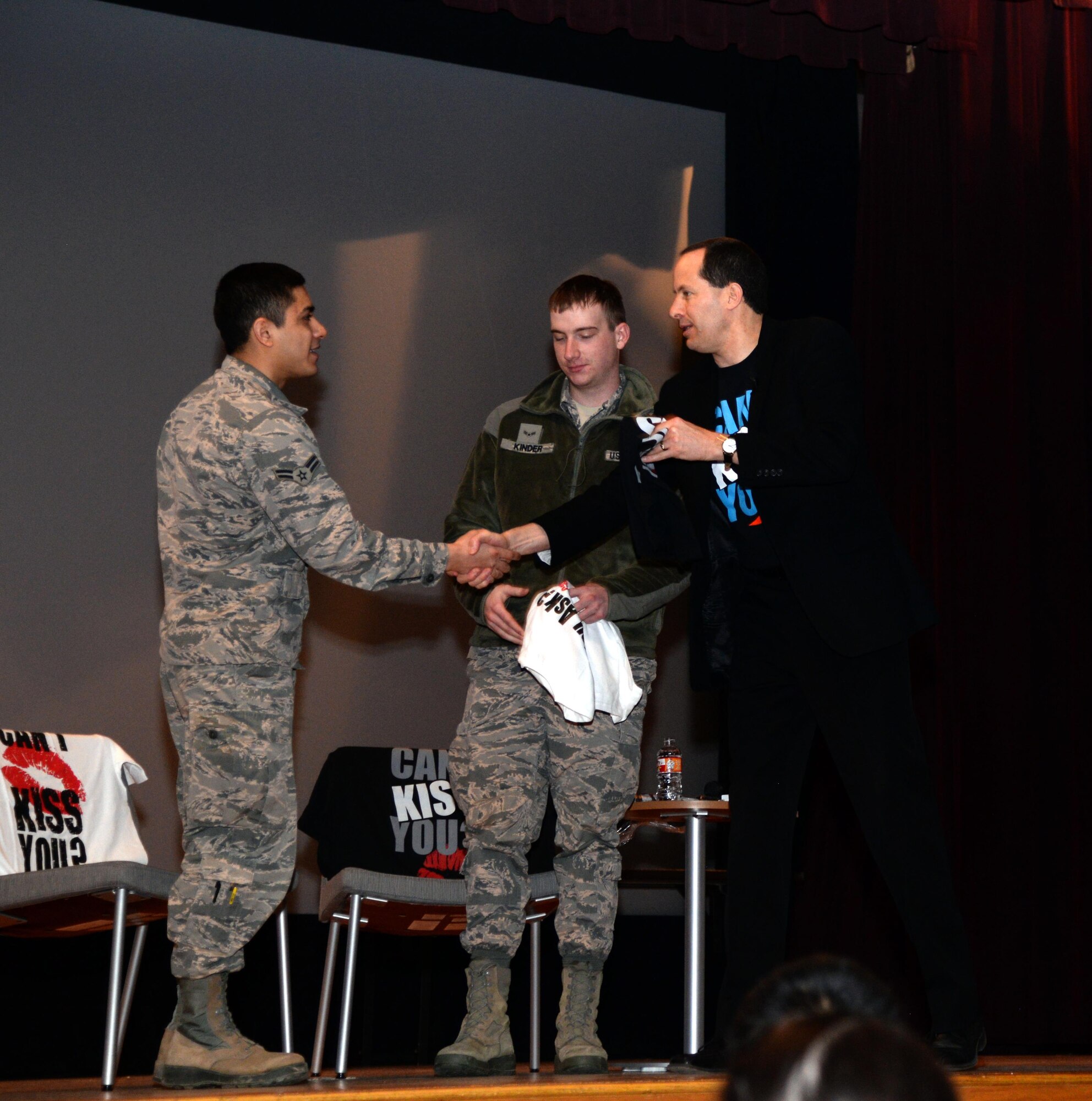 Mike Domitrz, Date Safe Project’s president and founder, thanks two Airmen during his “Can I Kiss You” presentation at Minot Air Force Base, N.D., Mar. 28, 2017. The Airmen had volunteered to demonstrate asking for consent. (U.S. Air Force photo/Airman 1st Class Dillon J. Audit)