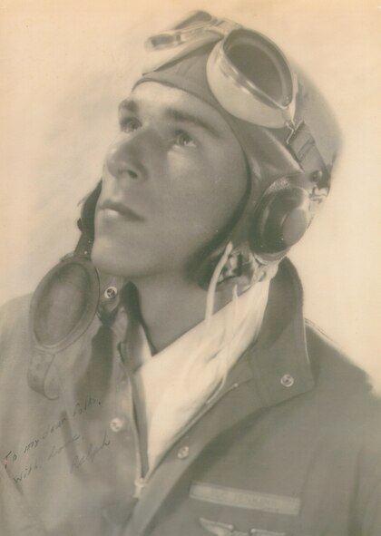 Col. (ret.) Ralph Jenkins, 510th Fighter Squadron commander, poses for a photo while serving as a fighter pilot during World War II. During one of the last reunions with his squadron members a pact was made that when the last two surviving members remained they would raise a toast of brandy to their fallen comrades. In an effort that spanned more than 2,800 miles, a bottle of 1945 Calvados Brandy has been delivered to Jenkins to make this event happen. (Courtesy photo)
