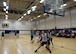 Multiple players from the 97th Wing Staff Agencies and 97th Logistics Readiness Squadrons compete during the 2017 Altus Air Force Base Basketball championship, April 4, 2017, at Altus AFB, Oklahoma. The Fitness Center offers several sports throughout the year as a way to support Airmen morale and comradery. (U.S. Air Force Photo by Airman 1st Class Jackson N. Haddon/Released).
