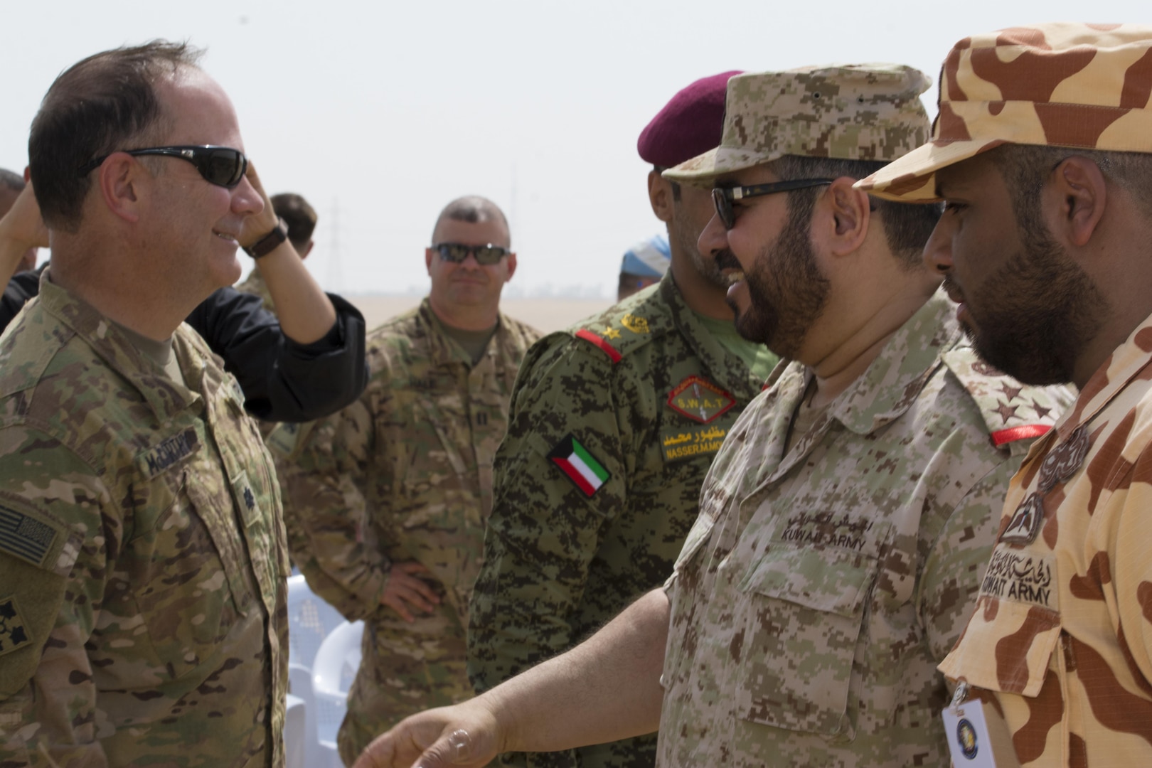 Kuwait- A large crowd of foreign and U.S. dignitaries meet to view teams from their combined special forces- Qatar, Kuwait, Saudi Arabia and the United States, during an explosive training mission  proving the successful interoperability of both land and air assets as well as highlighting the vast skills of the varied partner nations part of Operation Eagle Resolve, April 2. 
(Photo by Army Sgt. 1st Class Suzanne Ringle/Released)