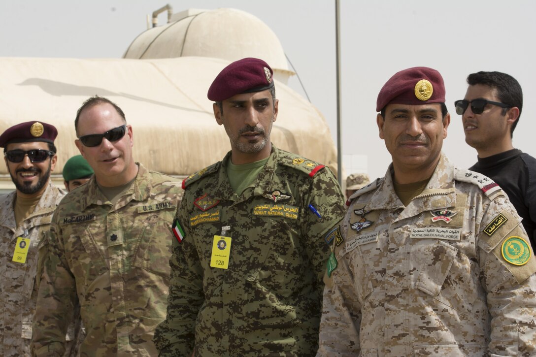 Kuwait- A large crowd of foreign and U.S. dignitaries meet to view teams from their combined special forces- Qatar, Kuwait, Saudi Arabia and the United States, during an explosive training mission  proving the successful interoperability of both land and air assets as well as highlighting the vast skills of the varied partner nations part of Operation Eagle Resolve, April 2. 
(Photo by Army Sgt. 1st Class Suzanne Ringle/Released)