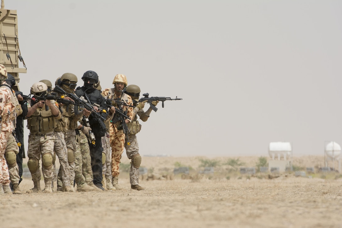 Kuwait- A large crowd of foreign and U.S. dignitaries view teams from their combined special forces- Qatar, Kuwait, Saudi Arabia and the United States, during an explosive training mission  proving the successful interoperability of both land and air assets as well as highlighting the vast skills of the varied partner nations part of Operation Eagle Resolve, April 2. 
(Photo by Army Sgt. 1st Class Suzanne Ringle/Released)