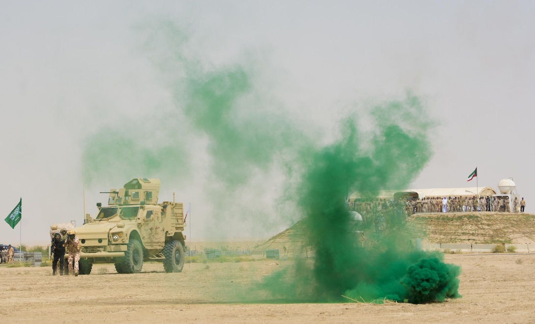 Kuwait- A large crowd of foreign and U.S. dignitaries view teams from their combined special forces- Qatar, Kuwait, Saudi Arabia and the United States, use helicopters and armored vehicles during an explosive training mission  proving the successful interoperability of both land and air assets as well as highlighting the vast skills of the varied partner nations part of Operation Eagle Resolve, April 2. 
(Photo by Army Sgt. 1st Class Suzanne Ringle/Released)