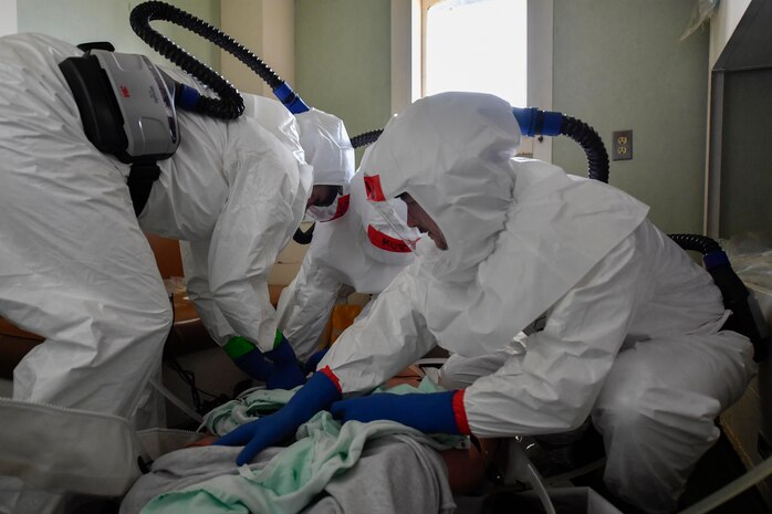 Members of Medical University of South Carolina provide medical care to a simulated patient during a communicable disease exercise at the Charleston, S.C. Federal Law Enforcement compound April 4, 2017. The exercise, the first of its kind here, tested communication procedures and the integration of federal, state, local and private industry partners while analyzing response capabilities if an infected person needed to be transported from a vessel to the Port of Charleston. 