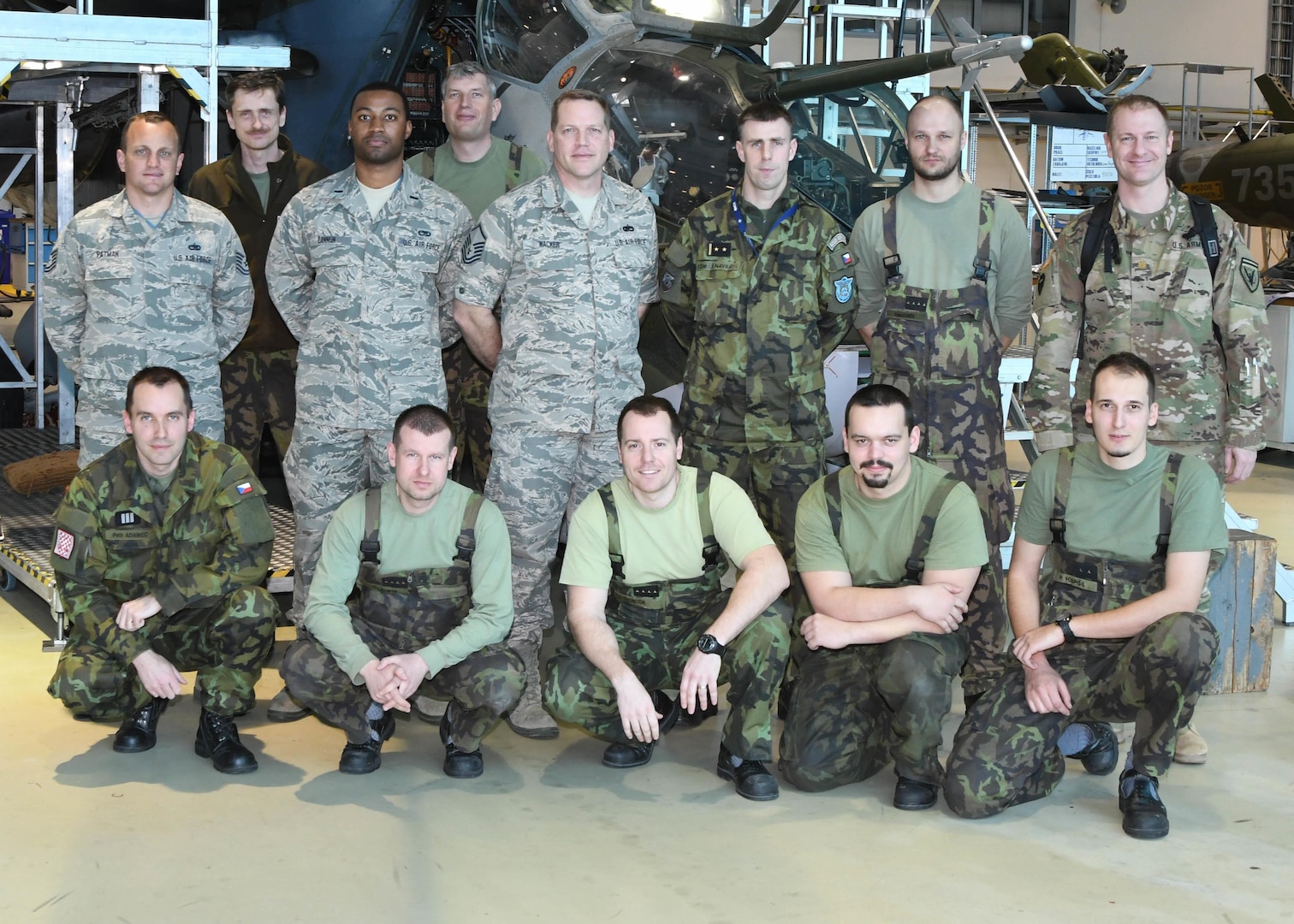 Airmen with the Texas and Nebraska Air National Guard, Army National Guard and the Czech Air Force pose for a photo March 22, 2017, at the 22nd Helicopter Air Base, Namest Nab Oslavou, Czech Republic. The services participated a maintenance exchange as part of the state partnership program between the Czech Republic, and the Texas and Nebraska National Guard units. 