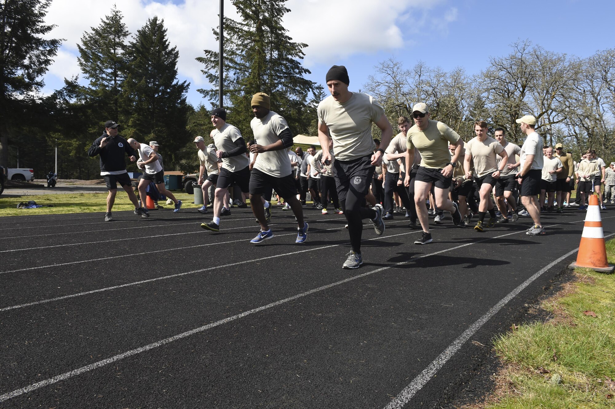 More than 200 members, military and civilians, of the 1st Air Support Operations Group, 194th ASOG, 62nd Airlift Wing and Joint Base Lewis- McChord, Wash., run and walk on the McChord Field outdoor track, March 30, 2017, to honor TACP Airmen who have died in combat or training and to raise money and awareness for the Tactical Air Control Party Association. To date, the TACP-A has given more than $200K back to the community and their families. (Air Force Photo/ Staff Sgt. Naomi Shipley)