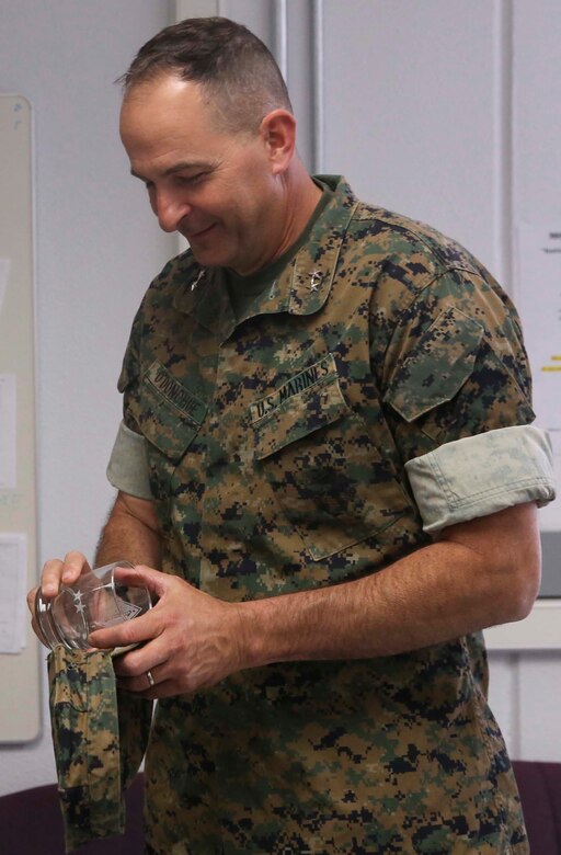 Maj. Gen. Daniel O’Donohue, Commanding General, 1st Marine Division, admires a glass that was laser-cut with his rank and unit emblem following a visit to the Fabrication Laboratory aboard Marine Corps Air Ground Combat Center, Twentynine Palms, Calif., March 29, 2017. The newly established FabLab is the first of its kind in the Marine Corps and will provide Marines and sailors the opportunity to develop avant-garde solutions to common problems through utilizing 3D printing technology. (U.S. Marine Corps photo by Cpl. Medina Ayala-Lo)