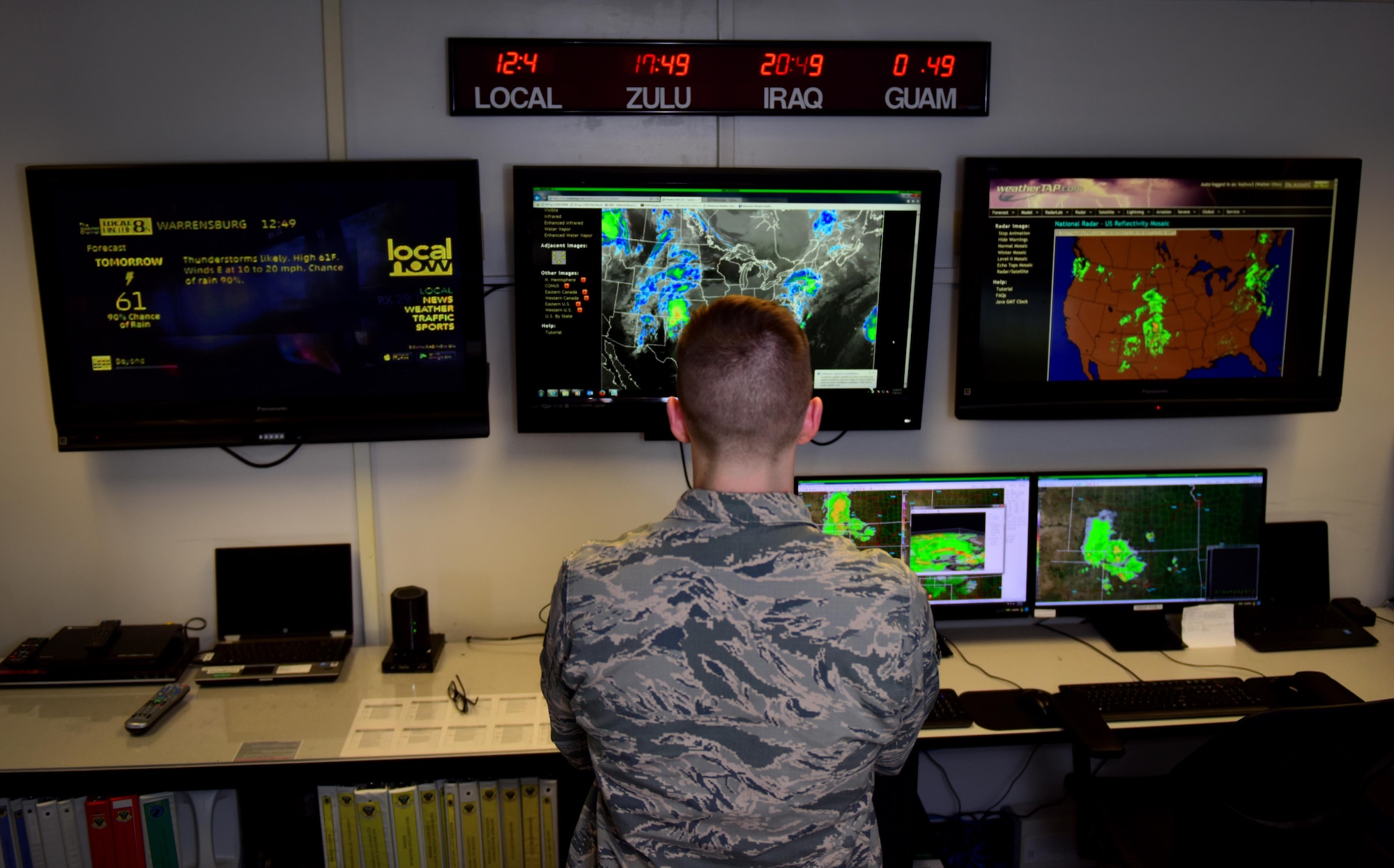U.S. Air Force Senior Airman Alex Knowles, a weather forecaster assigned to the 509th Operations Support Squadron, studies a severe weather outbreak to see if and how it will impact base operations at Whiteman Air Force Base, Mo., March 28, 2017. All forecasters are educated in a broad spectrum of natural sciences and are current on forecast techniques, tactical equipment and data analysis. (U.S. Air Force photo by Airman 1st Class Jazmin Smith)