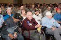 Members of the 307th Bomb Wing alumni groups attached streamers to the 307th Maintenance Squadron&#39;s guidon representing awards received during World War II, the Korean War, Vietnam and the Cold War during the 75th Anniversary Celebration. 