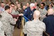 Members of the 307th Bomb Wing alumni groups attached streamers to the 307th Maintenance Squadron's guidon representing awards received during World War II, the Korean War, Vietnam and the Cold War during the 75th Anniversary Celebration. 