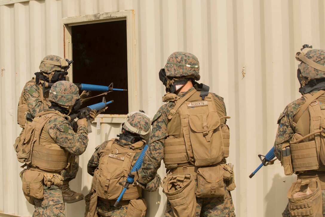 Marines ensure a room is clear before climbing in during a Basic Urban Skills Training course at a Military Operations on Urbanized Terrain event at Camp Lejeune, N.C., April 5, 2017. The Marines participated in the training to learn and reinforce infantry skills as a predeployment work up. The Marines are with 2nd Light Armored Reconnaissance Battalion, Bravo Company, 2nd Marine Division. (U.S. Marine Corps photo by Pfc. Abrey D. Liggins)