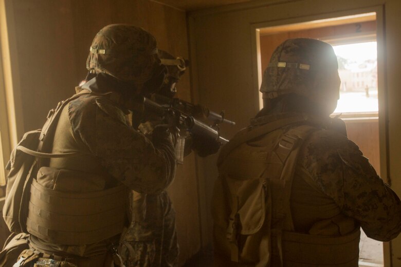 Marines prepare to clear a room during a Basic Urban Skills Training course at a Military Operations on Urbanized Terrain event at Camp Lejeune, N.C., April 5, 2017. The Marines participated in the training to learn and reinforce infantry skills as a predeployment work up. The Marines are with 2nd Light Armored Reconnaissance Battalion, Bravo Company, 2nd Marine Division. (U.S. Marine Corps photo by Pfc. Abrey D. Liggins)