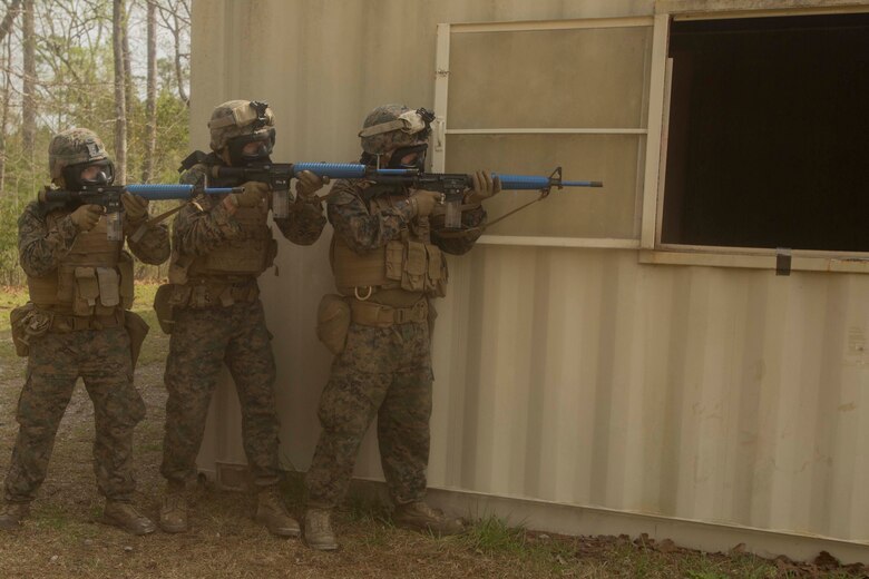 Marines prepare to secure a building during a Basic Urban Skills Training course at a Military Operations on Urbanized Terrain event at Camp Lejeune, N.C., April 5, 2017. The Marines participated in the training to learn and reinforce infantry skills as a predeployment work up. The Marines are with 2nd Light Armored Reconnaissance Battalion, Bravo Company, 2nd Marine Division. (U.S. Marine Corps photo by Pfc. Abrey D. Liggins)
