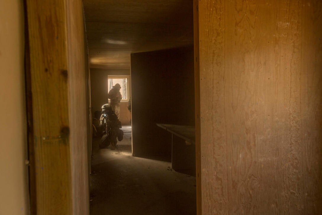 A Marine provides security as his fire team clears a room during a Basic Urban Skills Training course at a Military Operations on Urbanized Terrain event at Camp Lejeune, N.C., April 5, 2017. The Marines participated in the training to learn and reinforce infantry skills as a predeployment work up. The Marines are with 2nd Light Armored Reconnaissance Battalion, Bravo Company, 2nd Marine Division. (U.S. Marine Corps photo by Pfc. Abrey D. Liggins)