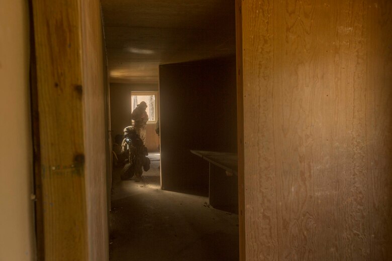A Marine provides security as his fire team clears a room during a Basic Urban Skills Training course at a Military Operations on Urbanized Terrain event at Camp Lejeune, N.C., April 5, 2017. The Marines participated in the training to learn and reinforce infantry skills as a predeployment work up. The Marines are with 2nd Light Armored Reconnaissance Battalion, Bravo Company, 2nd Marine Division. (U.S. Marine Corps photo by Pfc. Abrey D. Liggins)