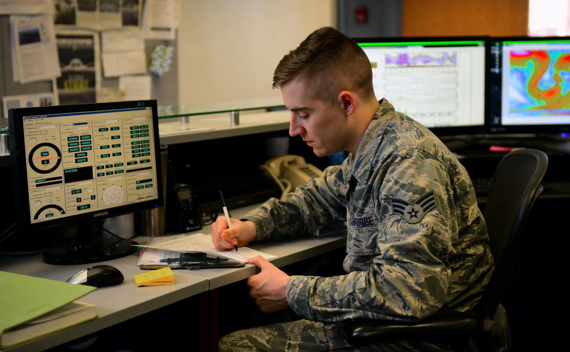 U.S. Air Force Senior Airman Alex Knowles, a weather forecaster assigned to the 509th Operations Support Squadron, jots down weather sensor data to relay to an aircrew at Whiteman Air Force Base, Mo., March 28, 2017. Personnel assigned to the weather flight are capable of deploying in support of operations around the world with specialized equipment, such as a deployable weather station. (U.S. Air Force photo by Airman 1st Class Jazmin Smith)
