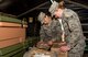 Senior Airman Paige Tranah, and Senior Airman Sarah Overlin, services specialists with the 934th Force Support Squadron working at the Dining Facility at Minneapolis-St. Paul Air Reserve Station, Mn., inspect packaged food items prior to preparing and serving them during the 2017 Hennessy competition. The food items must meet stringent guidelines in order to ensure the food is fresh and the expiration date has not been exceeded. 