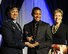 Eighteen-year-old Jamal Braxton receives the 2017 Air Force Military Child of the Year award during a gala in Pentagon City, Va., April 6, 2017, from Air Force Assistant Vice Chief of Staff Lt. Gen. Stayce Harris and Ellyn Dunford, spouse of Chairman of the Joint Chiefs of Staff Gen. Joseph F. Dunford Jr. The annual event celebrates military children who demonstrate leadership, resilience and strength of character, as well as an ability to thrive when dealing with the challenges inherent in military family life. (U.S. Air Force photo/Staff Sgt. Jannelle McRae)