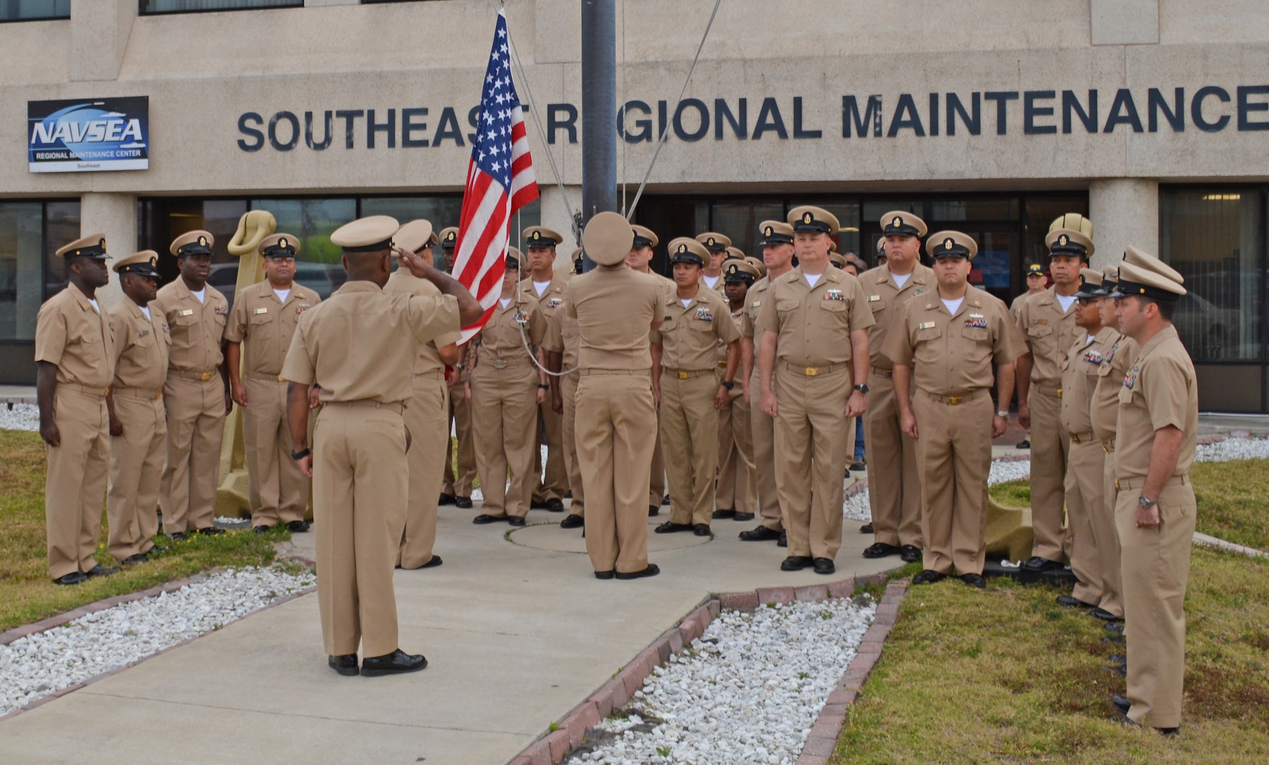 Active and retired Chief Petty Officers (CPO) render morning colors at Southeast Regional Maintenance Center (SERMC) March 31. Raising the colors is part of celebrating the birthday of the Chief, April 1st. The rank of CPO was established by President Benjamin Harrison when he signed General Order 409.

