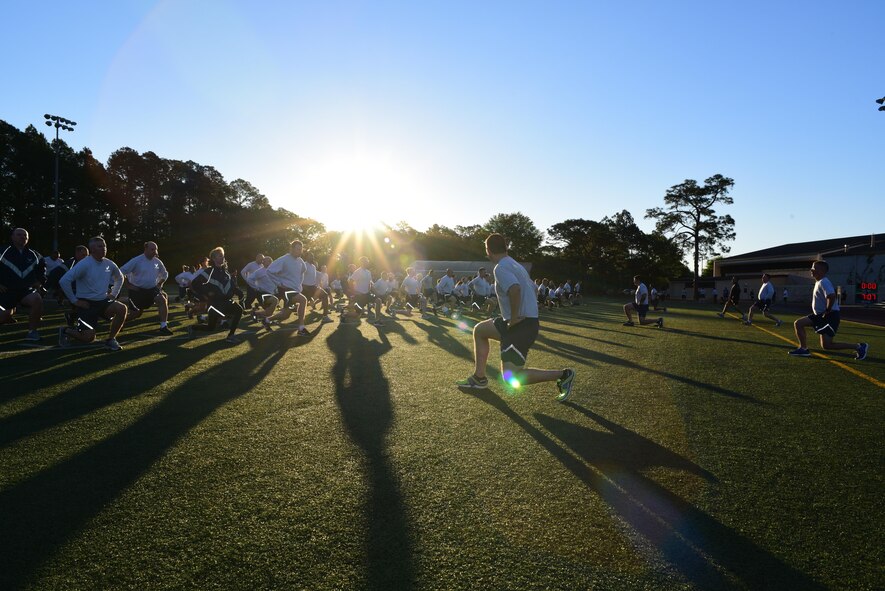 Air Commandos assigned to Headquarters Air Force Special Operations Command warm up before a 5K run at Hurlburt Field, Fla., April 7, 2017. The directorates and special staff members meet once a month to work out together. (U.S. Air Force photo/Staff Sgt. Melanie Holochwost)