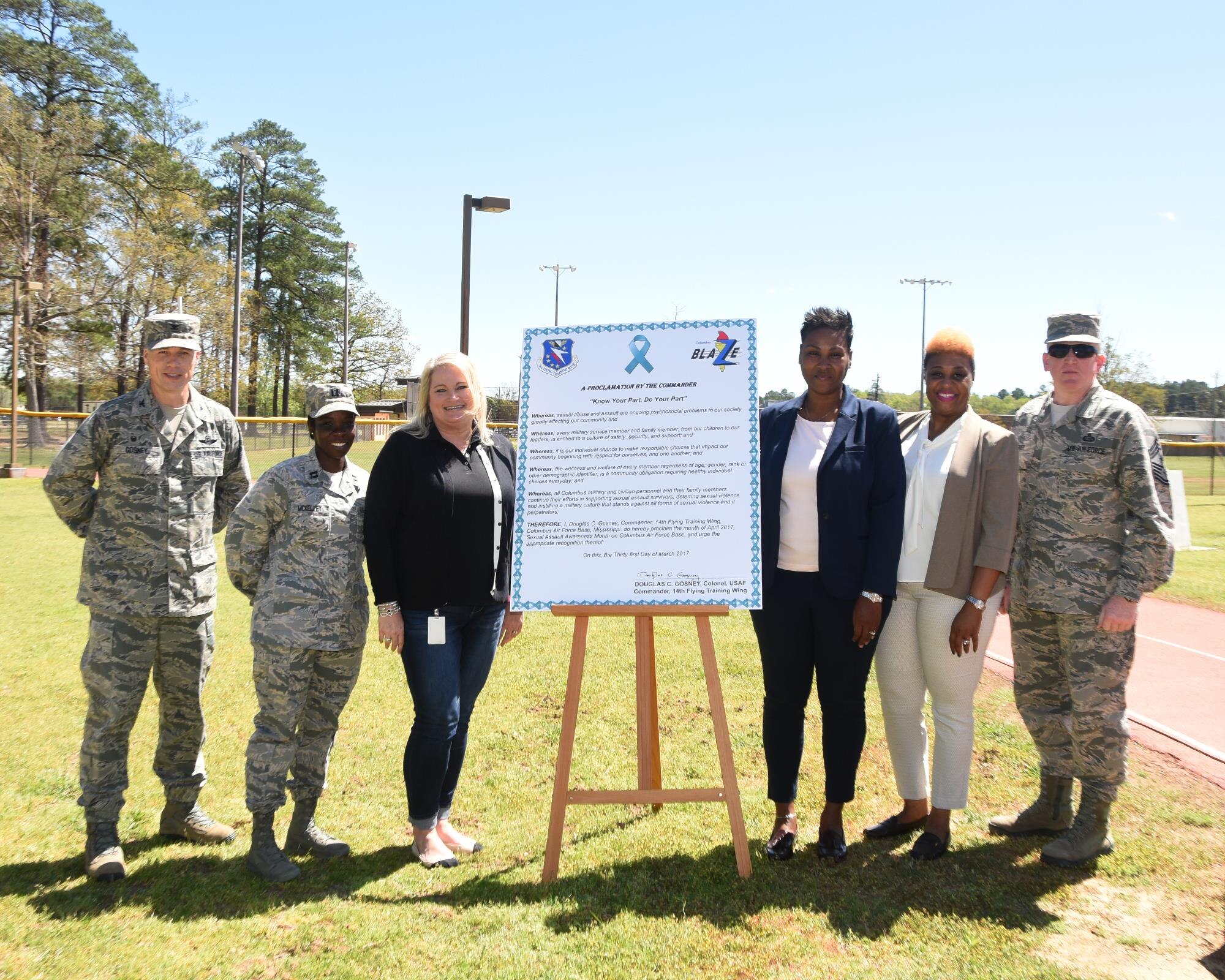 Col. Douglas Gosney, 14th Flying Training Wing Commander, poses for a photo after the signing of the Sexual Assault Awareness Month proclamation March 31, 2017, at Freedom Park on Columbus Air Force Base, Mississippi. Gosney was joined by the Sexual Assault Prevention and Response team at the signing.