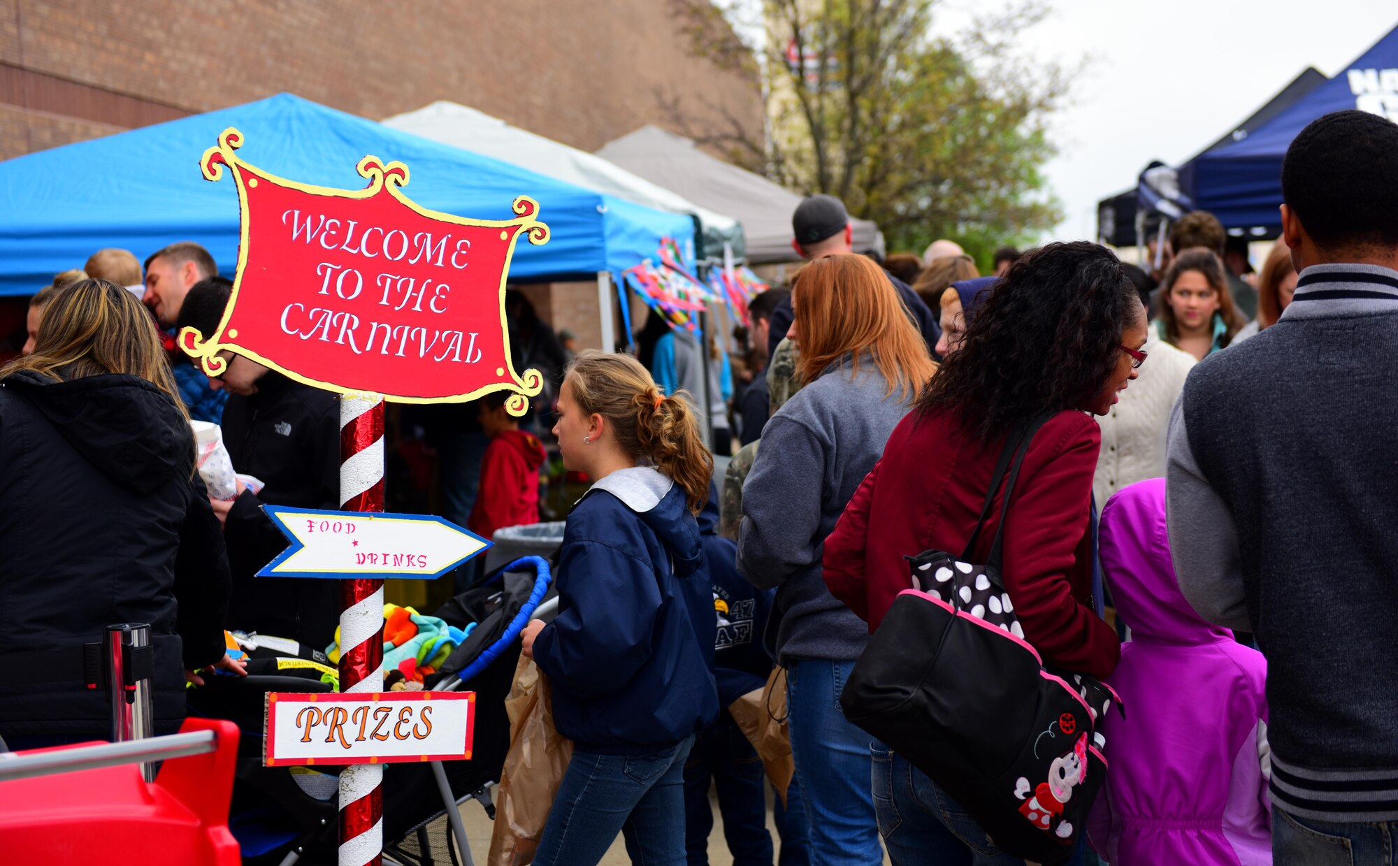 Members of Team Whiteman celebrate the Month of the Military Child during a carnival sponsored by the Defense Commissary Agency at Whiteman Air Force Base, Mo., April 1, 2017. Throughout the month of April, the community has the opportunity to recognize military children and youth for their bravery, character and resilience. (U.S. Air Force photo by Airman 1st Class Jazmin Smith)