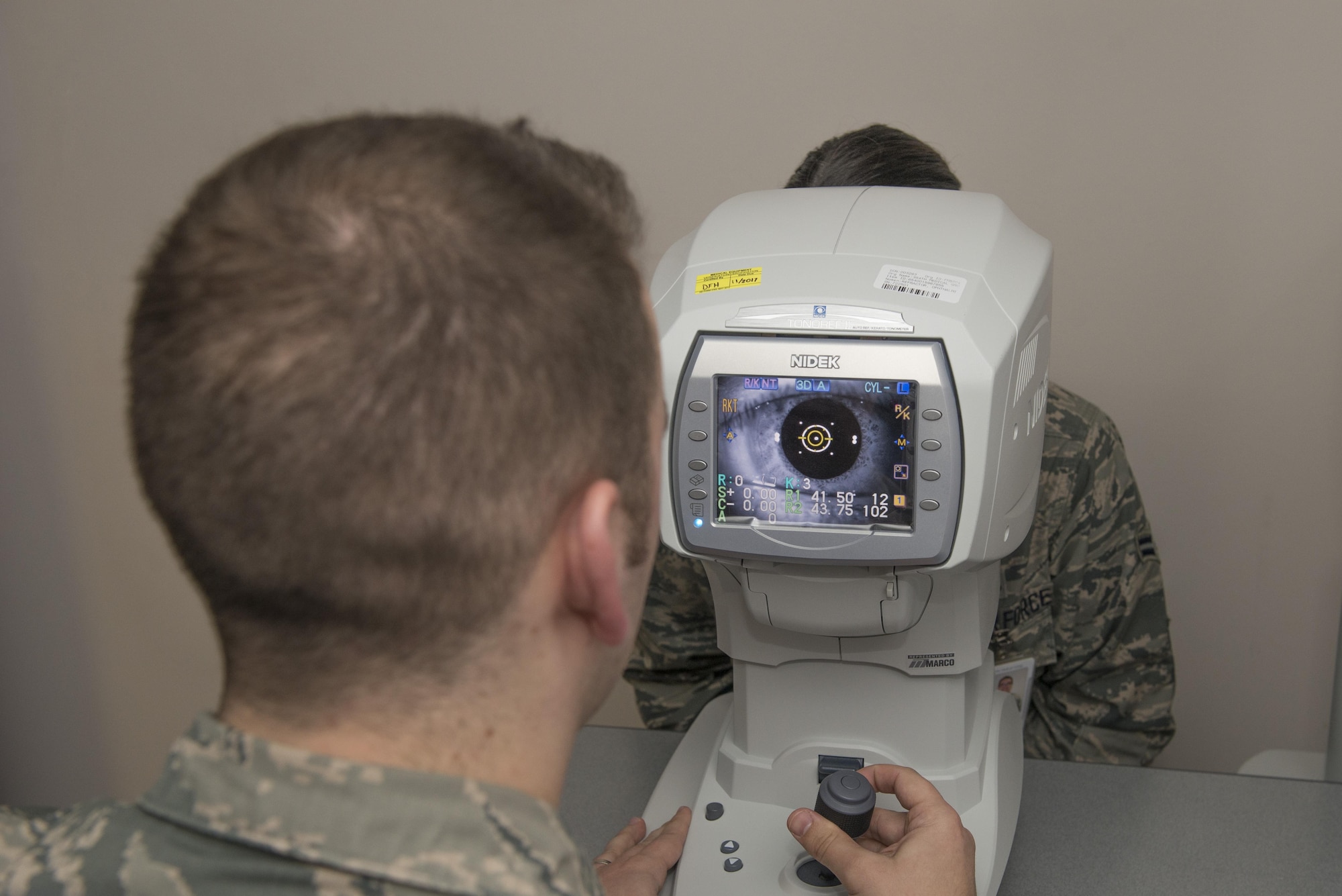 U.S. Air Force Tech. Sgt. Nicholas Hubbard, a 354th Medical Operations Squadron optometry technician, conducts an eye exam on an Airman April 3, 2017, at Eielson Air Force Base, Alaska. Hubbard believes in the value of trusted care and works to provide patients with anything they may need. (U.S. Air Force photo by Airman Eric M. Fisher)