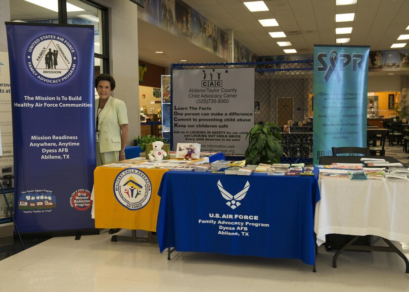 Sue Ann Simmons, 7th Medical Operations Squadron family advocacy outreach manager, runs an informational booth in honor of Child Abuse Awareness Month at Dyess Air Force Base, Texas, April 5, 2017. Simmons uses the booth to raise awareness and educate others to help end child abuse and neglect. (U.S. Air Force photo by Airman 1st Class Katherine Miller)